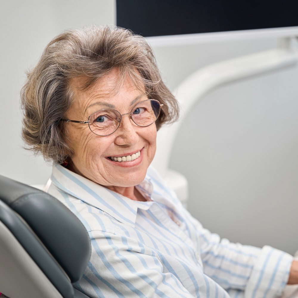 gray-haired-elderly-woman-sits-in-a-dentists-chair-2025-03-07-01-38-27-utc-web